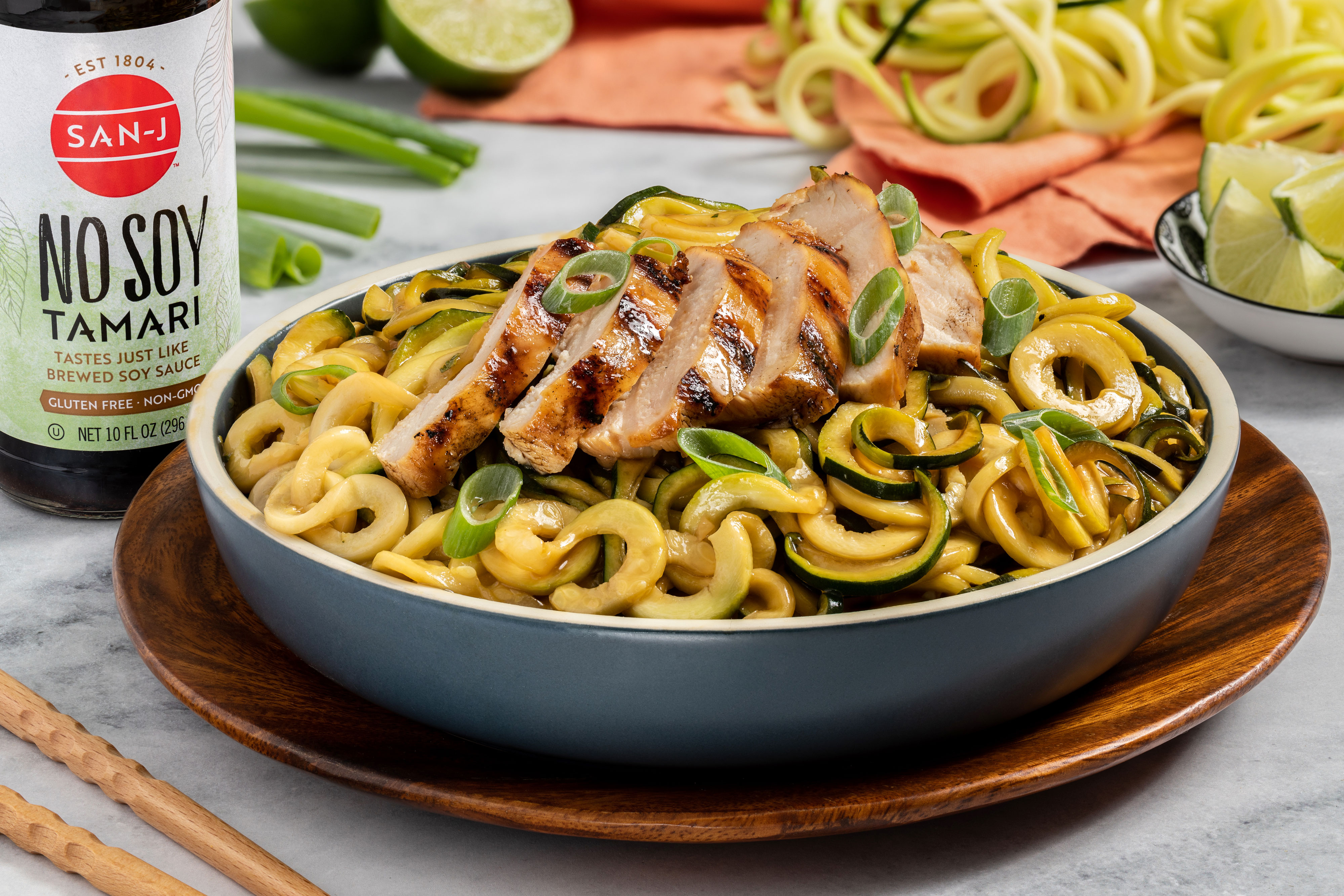 Thai chicken zucchini noodle bowl made with San-J No Soy Tamari